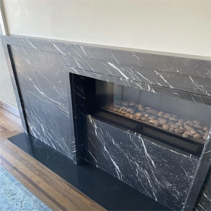 nero marquina marble fireplace
